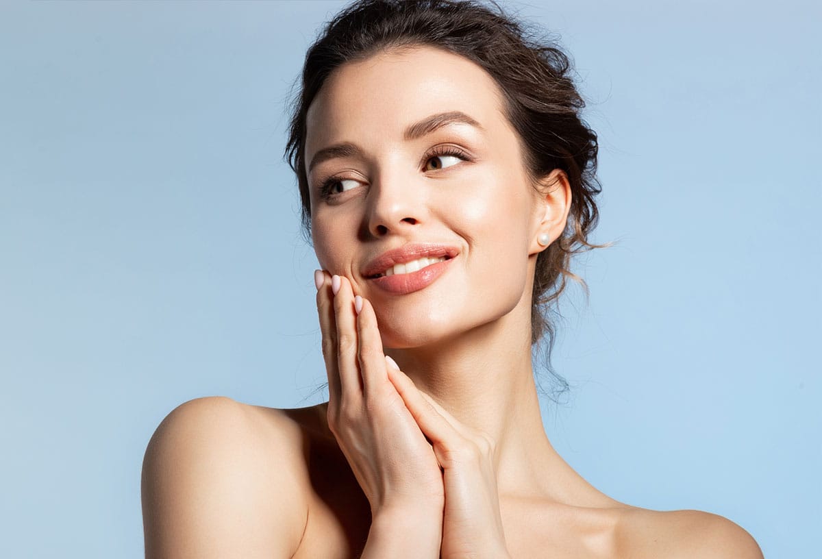 woman with glowing skin after getting a fotana laser facial in Westford, MA